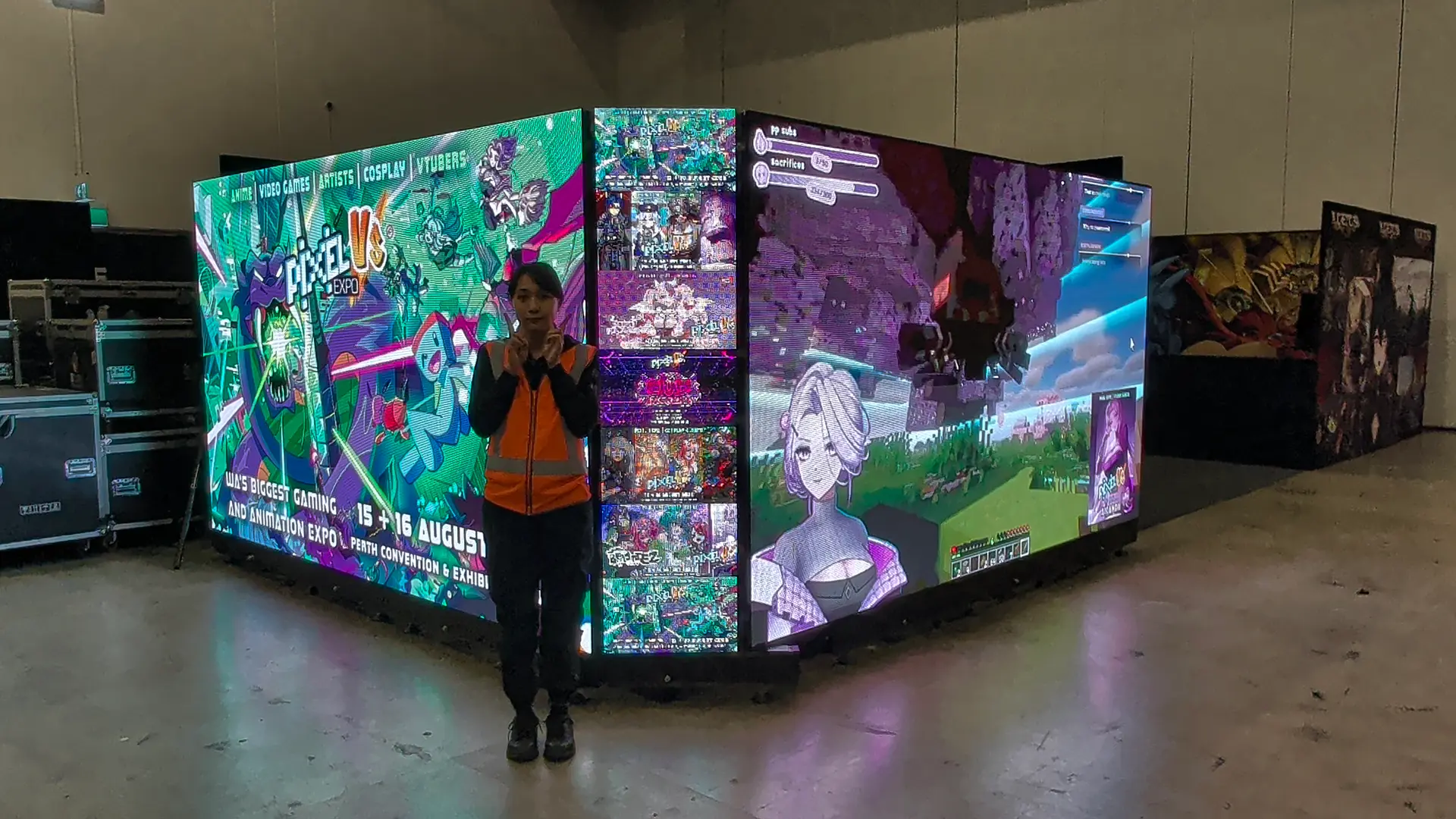 7.5 metre corner LED wall glowing at Supernova Perth with a crew member for scale